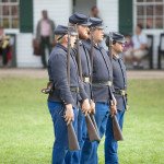 Soldiers in formation at Fort Mackinac during a rifle demonstration.