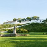 A panoramic view of Fort Mackinac and the Father Marquette Statue from Marquette Park.