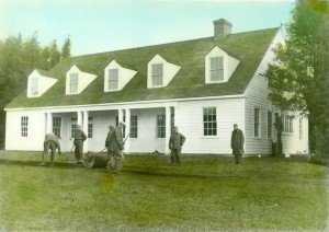 The barracks under construction and nearing completion with members of the CCC crew, 1934.