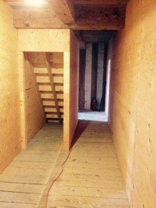 In addition to the new rooms, carpenters also created a new hallway in the center of the house.