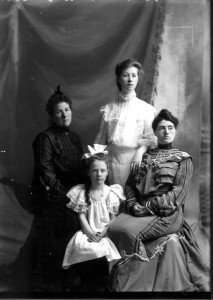 Belle Gallagher (left) with step-daughter Florence (standing), daughter Mary and an unknown woman, ca. 1905.