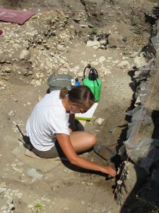 MSHP staff member Alex excavating in the root cellar. 