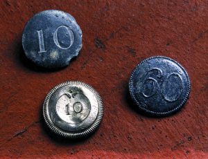 Three buttons discovered at Colonial Michilimackinac. They have 10s on them as they were for the 10th Regiment that were stationed at Fort Michilimackinac. 