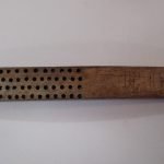A bone-brush handle with the letters E.D. carved into it