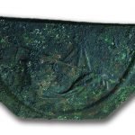 A brass hat plate from an American uniform
