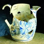 A hand-painted pitcher of pearlware
