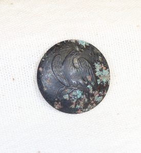 A button dating between 1812 and 1815 recovered at the Officers' Wood Quarters. 