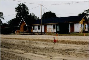 A photo of the Petersen Center being expanded by adding the former housing unit from Central Avenue. 