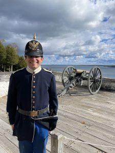 A soldier at the cannon platform at Fort Mackinac