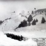 Fort Mackinac soldiers clearing a path in front of Fort Mackinac in the 1880s.
