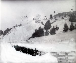 Fort Mackinac soldiers clearing a path in front of Fort Mackinac in the 1880s. 
