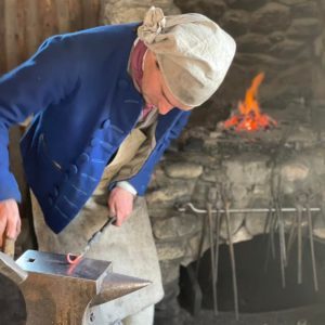 A blacksmith at work at Colonial Michilimackinac. 