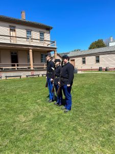 Soldiers marching on the Parade Ground at Fort Mackinac. 