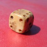 A bone or ivory gaming die recovered at Colonial Michilimackinac.