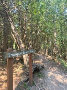 A sign for Tranquil Bluff Trail on Mackinac Island. 