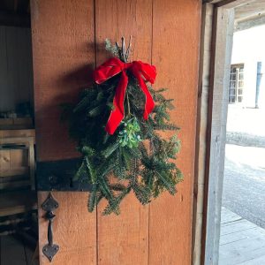A holiday swag hung on a door at Colonial Michilimackinac. 