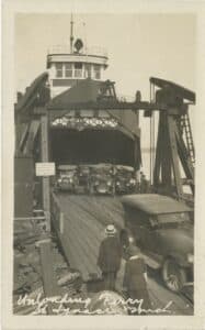 An image from the collection showing the Chief Wawatam and automobiles. 
