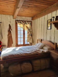 A room with a bed and a window.