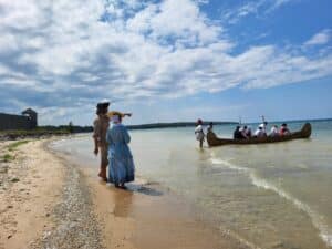 A canoe leaving Michilimackinac.