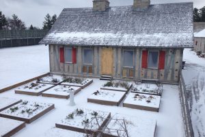 Some of the most complex work so far involved transforming four exterior doors into windows (see here without shutters) and cutting two new doorways (covered here with plywood) into the house.
