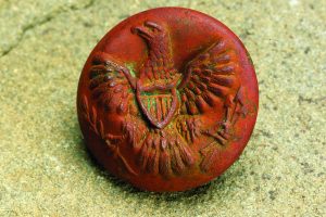 Although this “spread eagle with shield” button design was used from 1854-1902, its back mark of HORSTMANN BROS & CO/PHILA dates it to 1859-1863, within the date range of the third shop.]