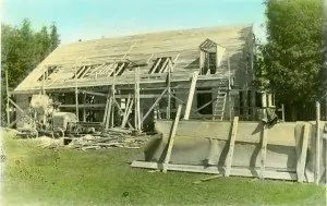 The barracks under construction and nearing completion with members of the CCC crew, 1934.