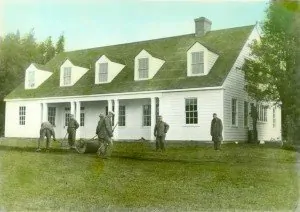 The barracks under construction and nearing completion with members of the CCC crew, 1934.