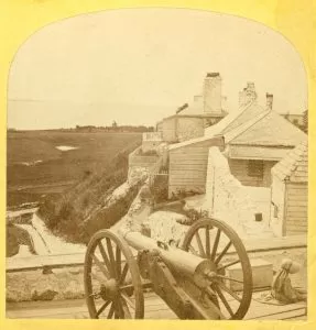 Howitzers, such as the one seen in this mid-1870s photo, had shorter barrels and could fire in a higher arc than a cannon.