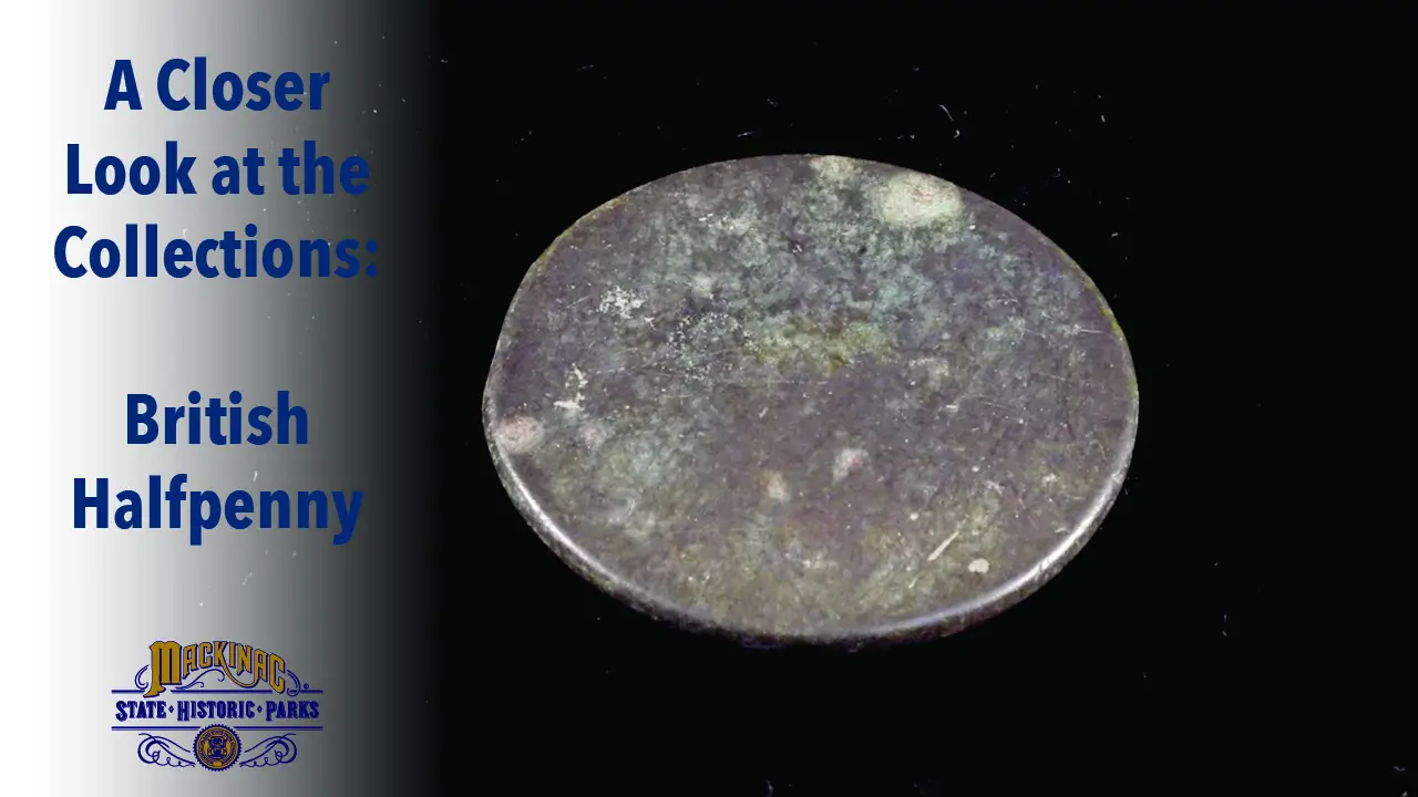 A photo of a British halfpenny recovered during an archaeological dig at Colonial Michilimackinac