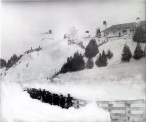 Fort Mackinac soldiers clearing a path in front of Fort Mackinac in the 1880s.