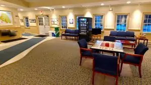 A picture of the lobby at Mackinac Island Airport, including a table and chairs.