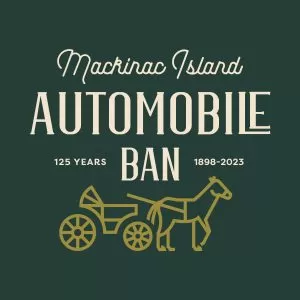 A logo for the Mackinac Island Automobile Ban in green and gold. 